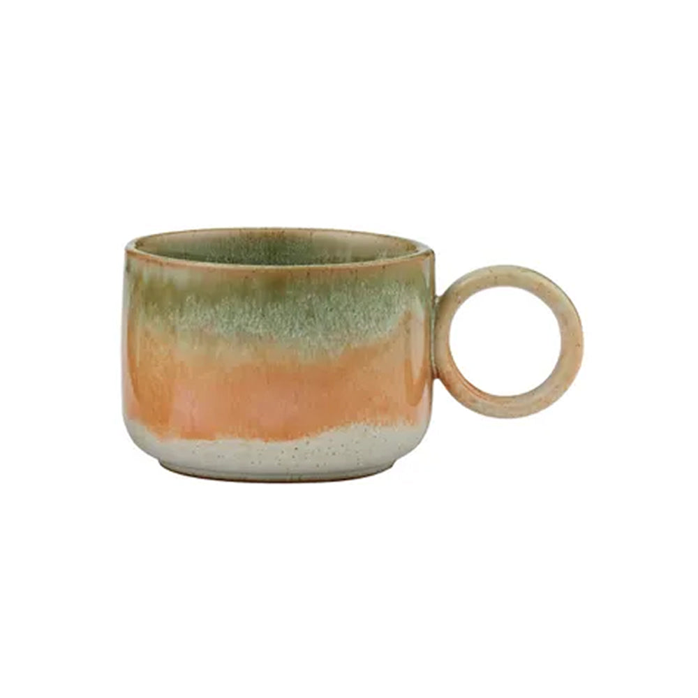 Ceramic mug with multicolored glaze on a white background