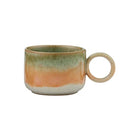 Ceramic mug with multicolored glaze on a white background